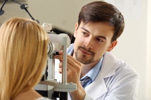 Optometrists testing a patients eyes for Glaucoma