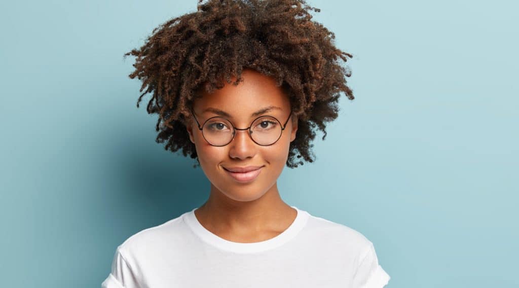 Beautiful African lady wearing fashionable vintage round spectacles